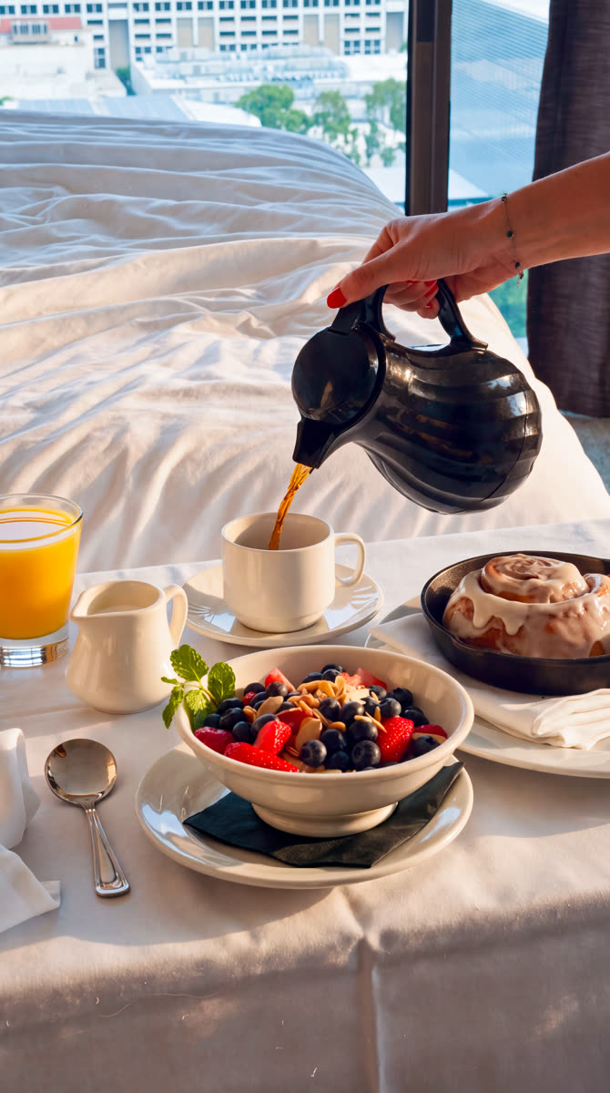 Breakfast in bed with coffee and fruit